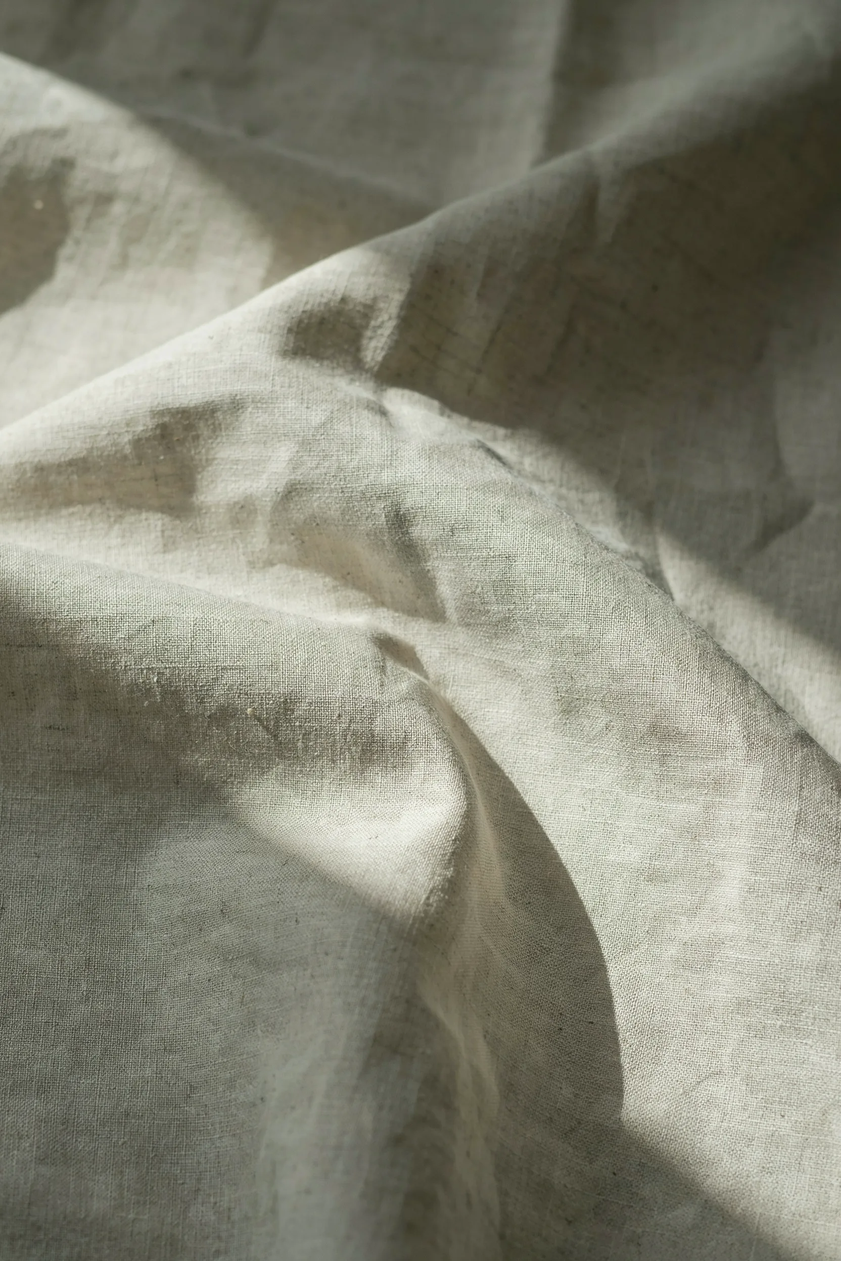 Folded natural linen in raking light